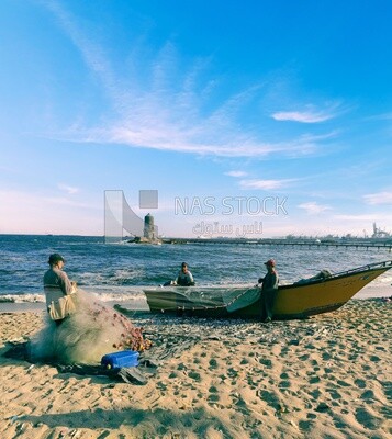 Group of fishermen untangle their nets to go fishing