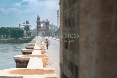 Egyptian cleaner cleans the Qanater Al-Khairiya Bridge