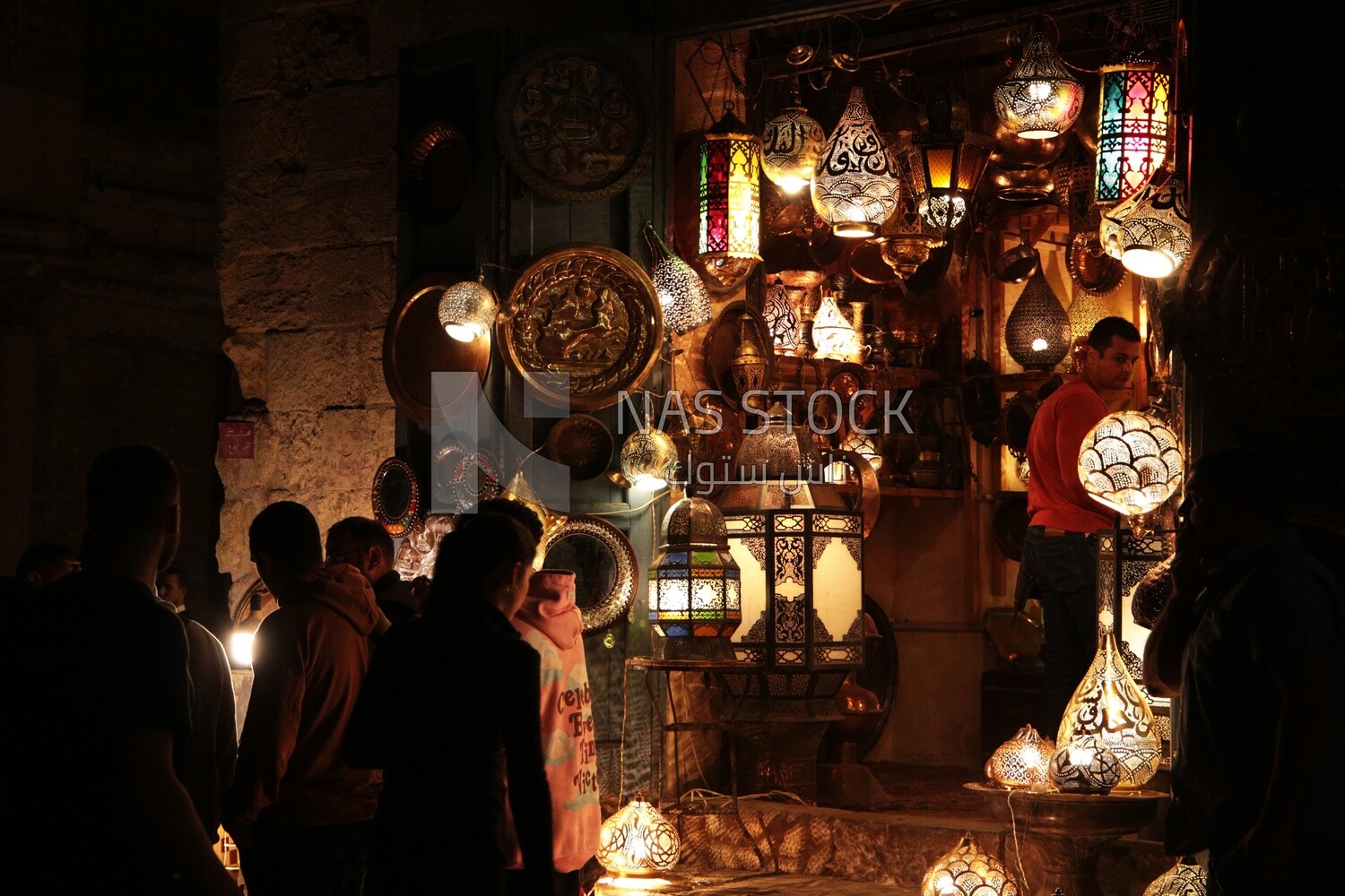 People on Al Moez Street at night, decoration lights