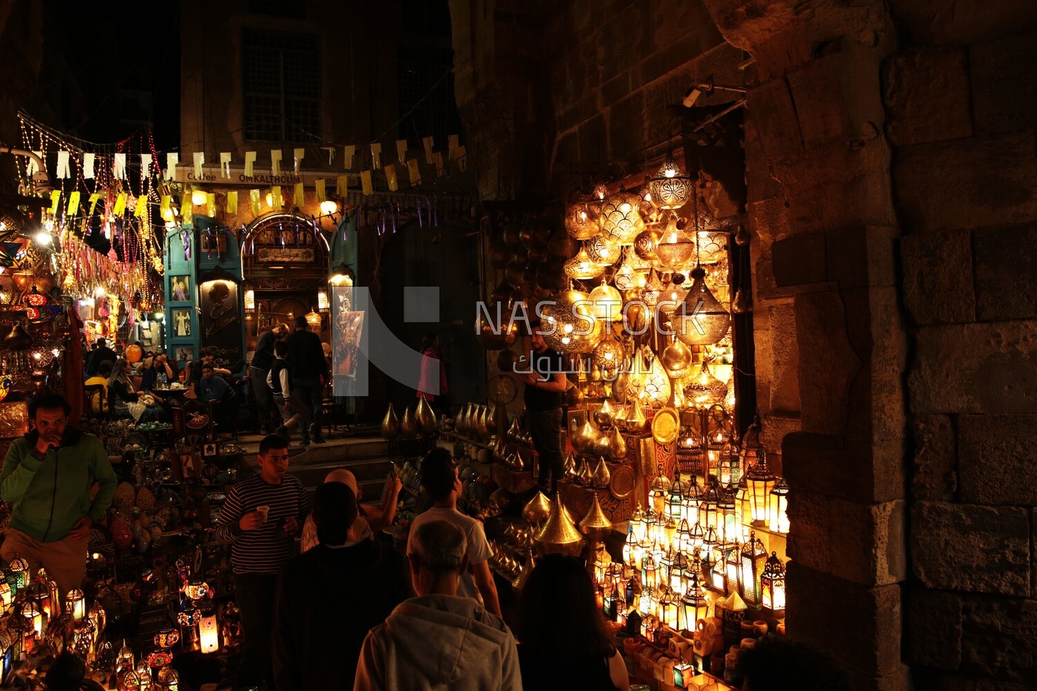 People on Al Moez Street at night, decoration lights