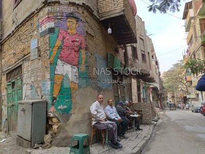 Group of Egyptian men sitting at a popular café in a Cairo neighborhood