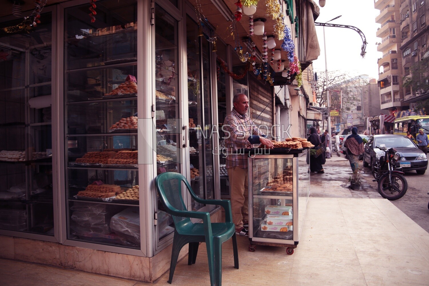 Man standing in a bakery store, traditional breakfast, street food