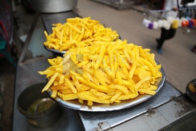 Plate of fried fries, traditional breakfast, street food