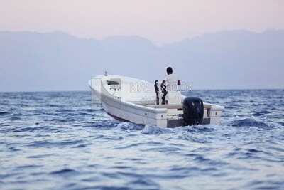 Young man sailing on a yacht in the Red Sea