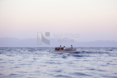 Group of Holidayers riding a boat in the sea, Abu Galum, Egypt