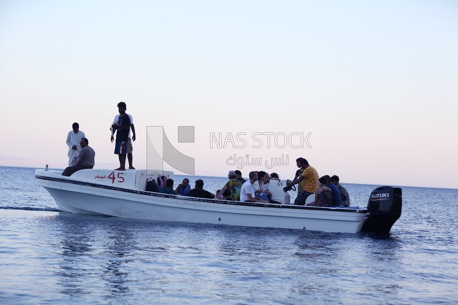 Group of Holidayers taking a boat tour