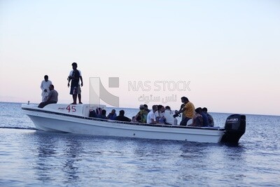 Group of Holidayers taking a boat tour