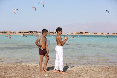 Two children taking pictures
