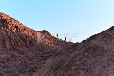 Two men coming down the mountain