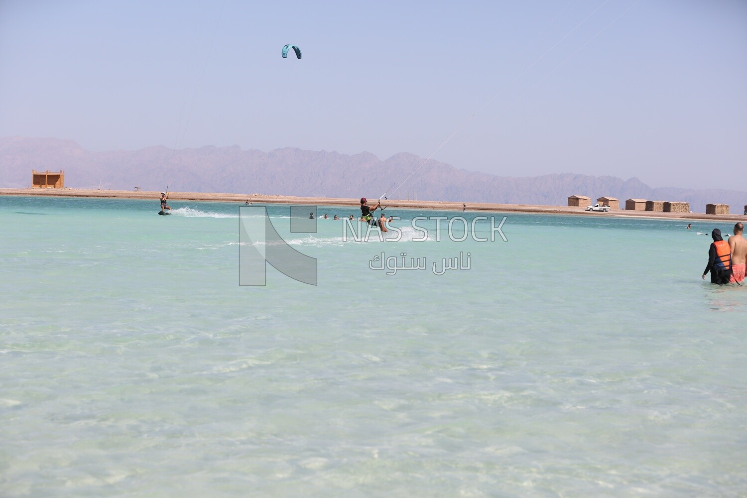 Beach of the tourist village is crowded with people