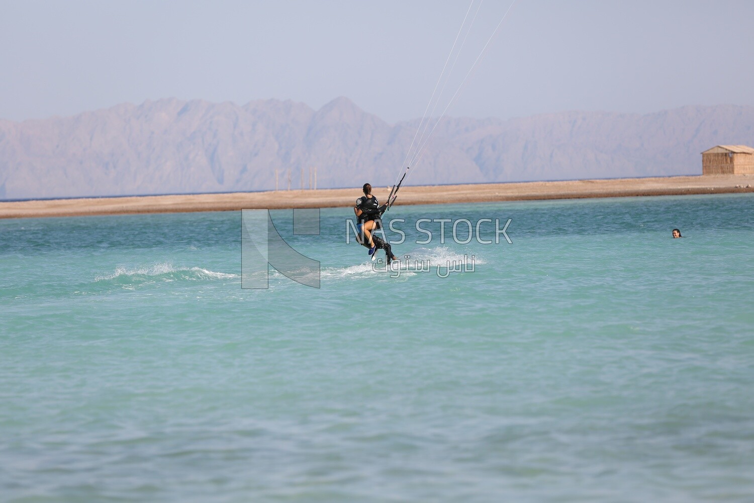 Young man and a girl enjoying water skiing