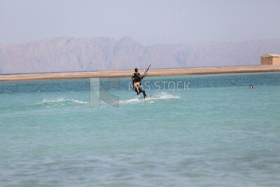 Young man and a girl enjoying water skiing