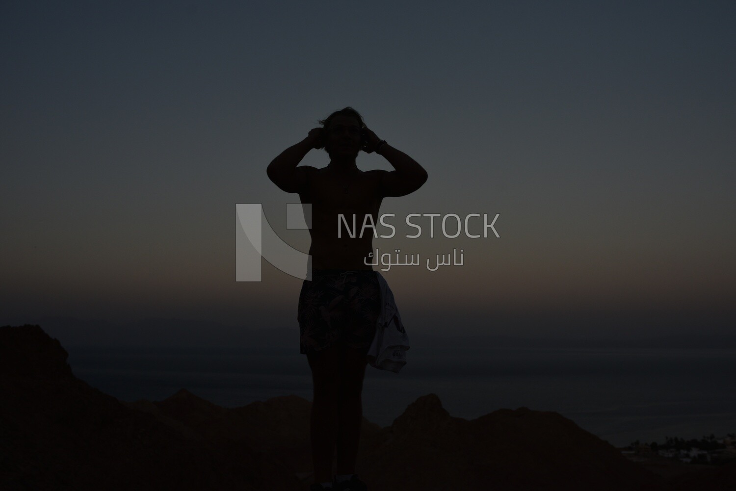 Woman practices yoga in a quiet area near the sea