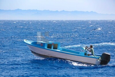 Guy sailing a boat
