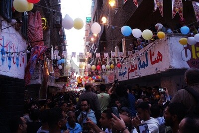View of people in Matareya sharing their iftar together in the street, Ramadan Kareem, preparing their iftar
