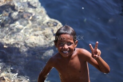 Child in a swimsuit smiling