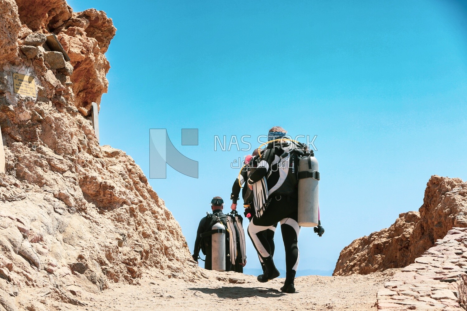 Tourists wearing diving suits