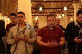 Worshipers praying in a mosque, performing the obligatory prayer in the mosque, worship and draw close to God