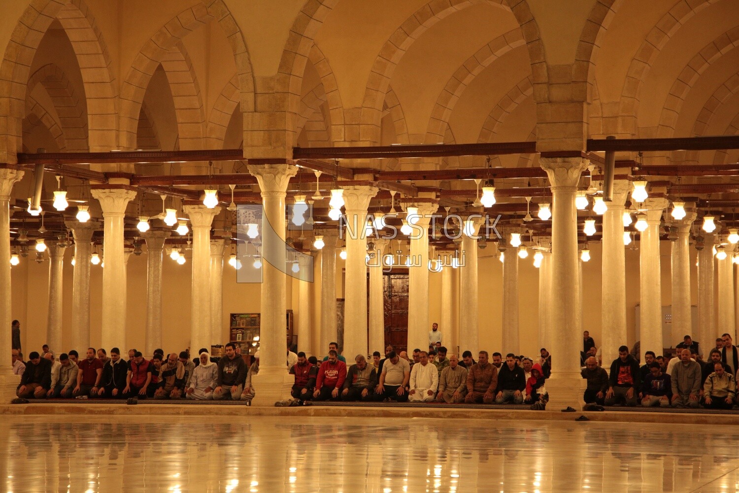 Worshipers praying in a mosque, performing the obligatory prayer in the mosque, worship and draw close to God
