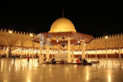 Worshipers sitting in a mosque, performing the obligatory prayer in the mosque, worship and draw close to God