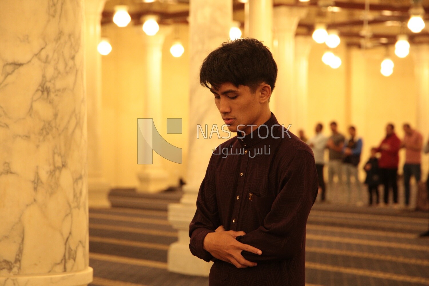 Man in the mosque, praying on the prayer rug, performing the obligatory prayer in the mosque, worship and draw close to God