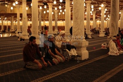 Worshipers praying in a mosque, performing the obligatory prayer in the mosque, worship and draw close to God