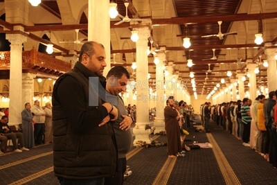 Worshipers praying in a mosque, performing the obligatory prayer in the mosque, worship and draw close to God