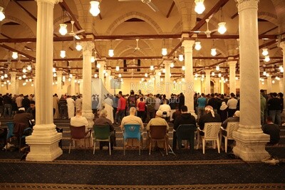 View from the back of the worshipers in the mosque, performing the obligatory prayer inside the mosque, reverence in prayer, performing the obligatory prayer in the mosque, worship and getting closer