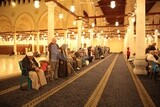 Worshipers praying in a mosque, performing the obligatory prayer in the mosque, worship and draw close to God