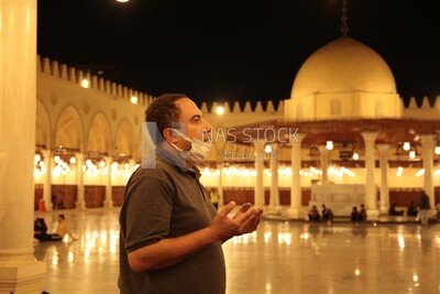 Man in the mosque, praying to God, praying on the prayer rug, performing the obligatory prayer in the mosque, worship and draw close to God