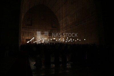 Worshipers praying in a mosque, performing the obligatory prayer in the mosque, worship and draw close to God