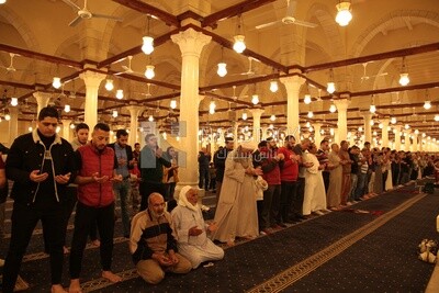 Worshipers praying in a mosque, performing the obligatory prayer in the mosque, worship and draw close to God