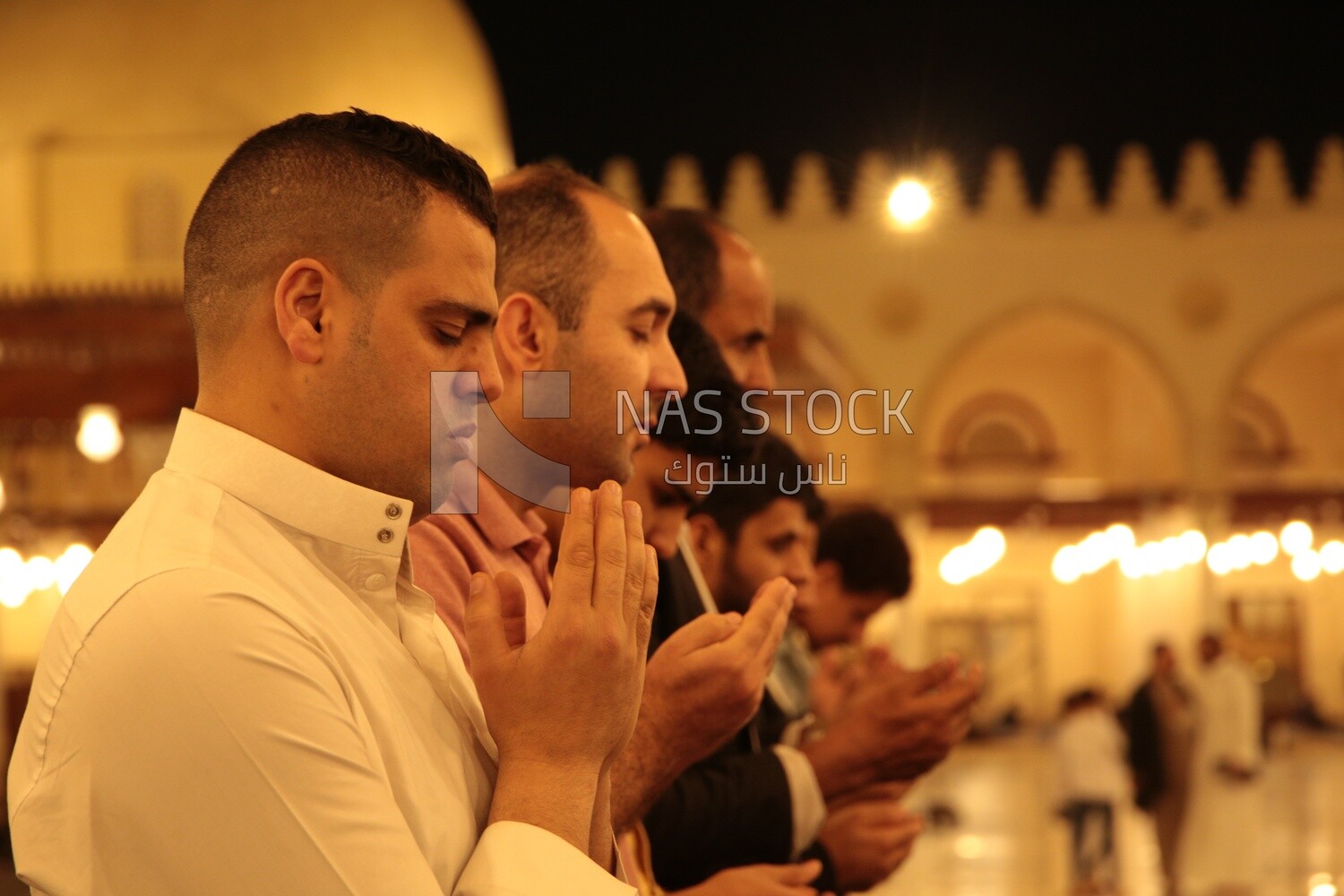 Worshipers praying in a mosque, performing the obligatory prayer in the mosque, worship and draw close to God