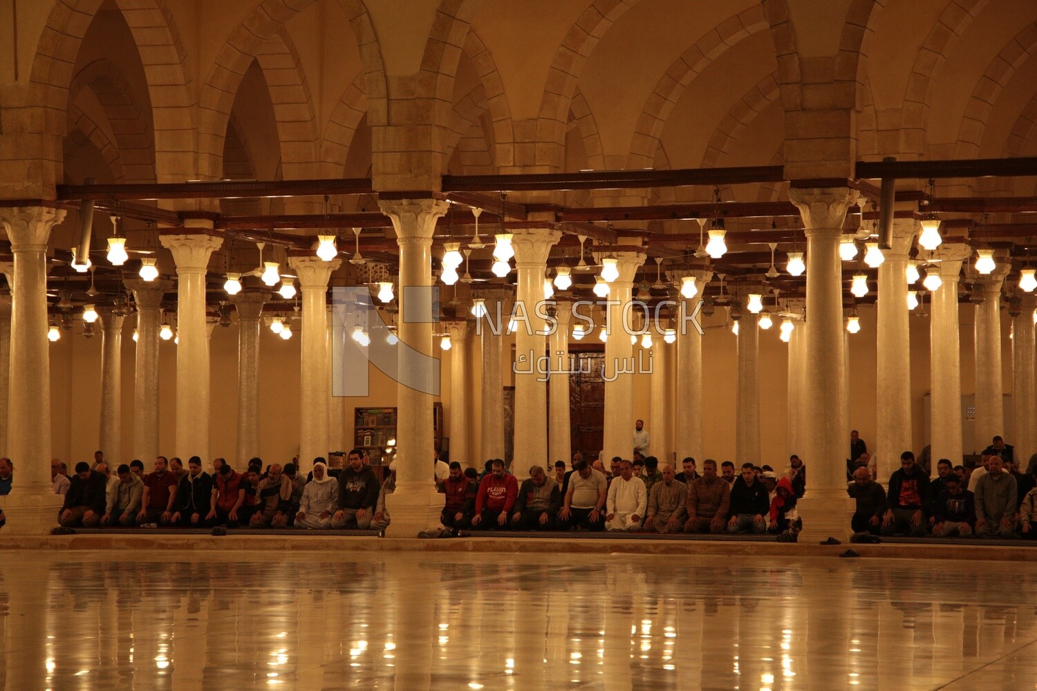 Worshipers praying in a mosque, performing the obligatory prayer in the mosque, worship and draw close to God