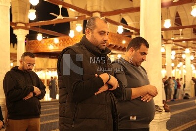 Worshipers praying in a mosque, performing the obligatory prayer in the mosque, worship and draw close to God