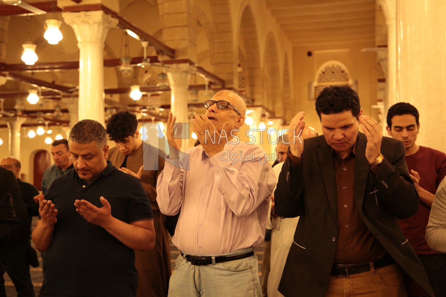Worshipers praying in a mosque, performing the obligatory prayer in the mosque, worship and draw close to God