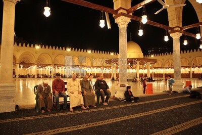 Worshipers praying in a mosque, performing the obligatory prayer in the mosque, worship and draw close to God