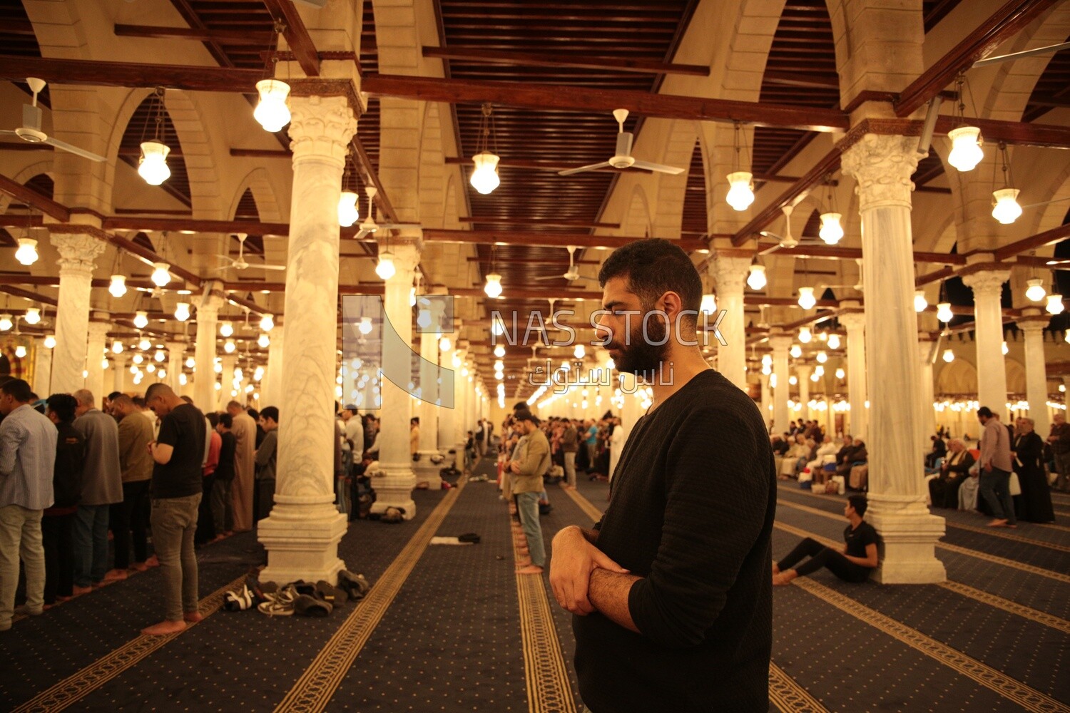 Worshipers praying in a mosque, performing the obligatory prayer in the mosque, worship and draw close to God