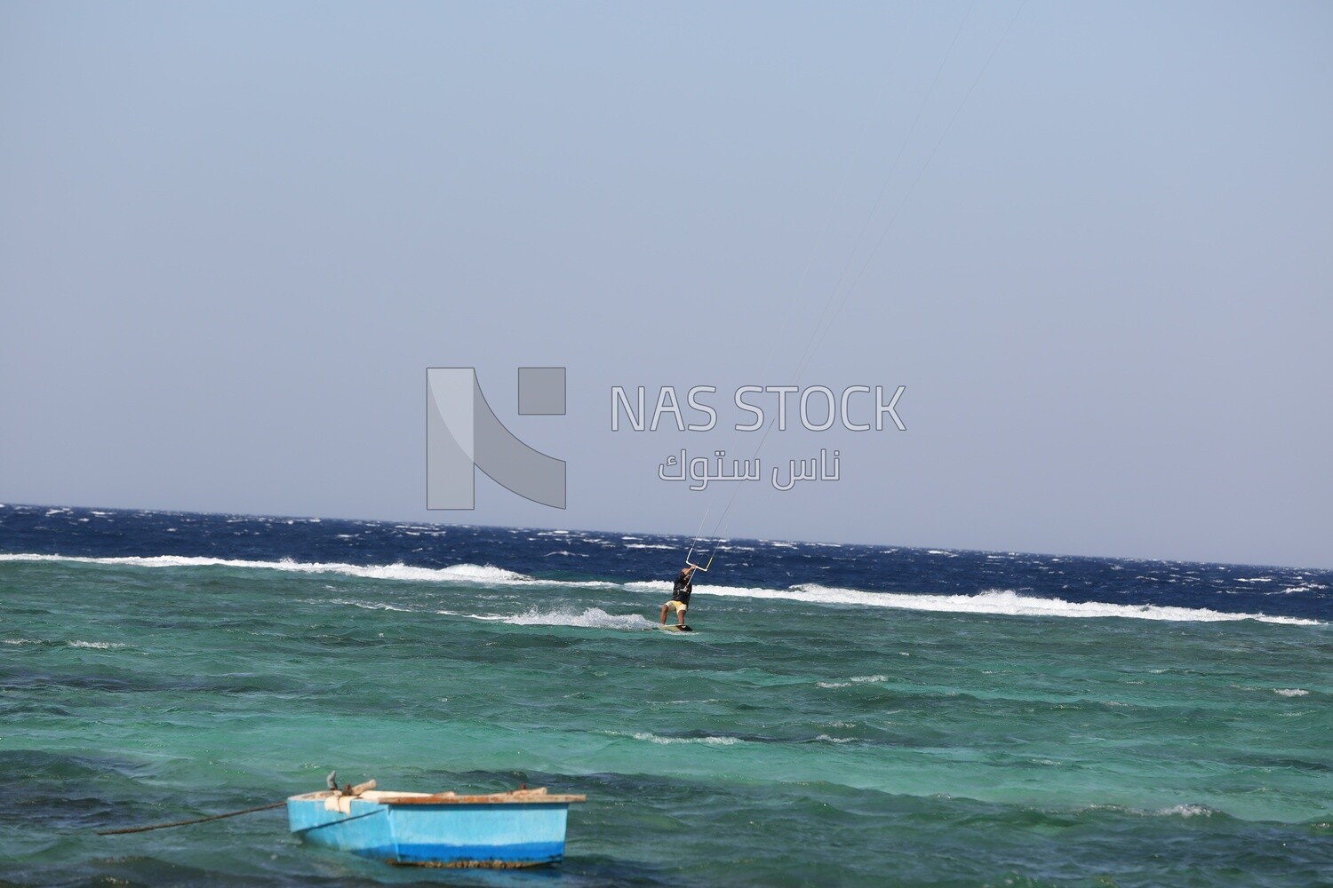 Guy enjoys skiing on the waters