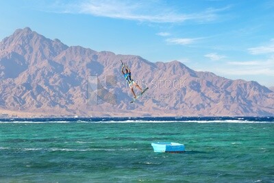 Young man water skiing in the city of Dahab