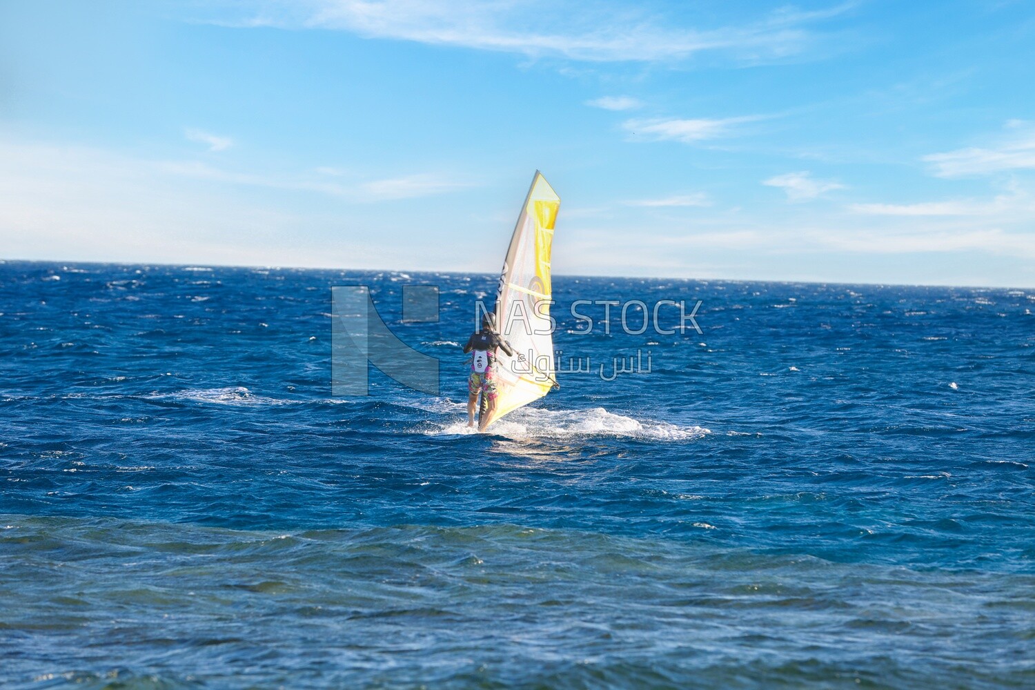 Guy enjoys skiing on the waters