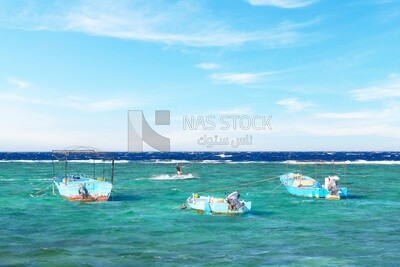 Group of wooden boats moored in the waters