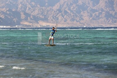Young man water skiing in the city of Dahab