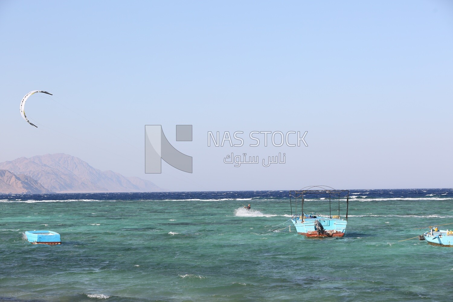 Group of wooden boats moored in the waters