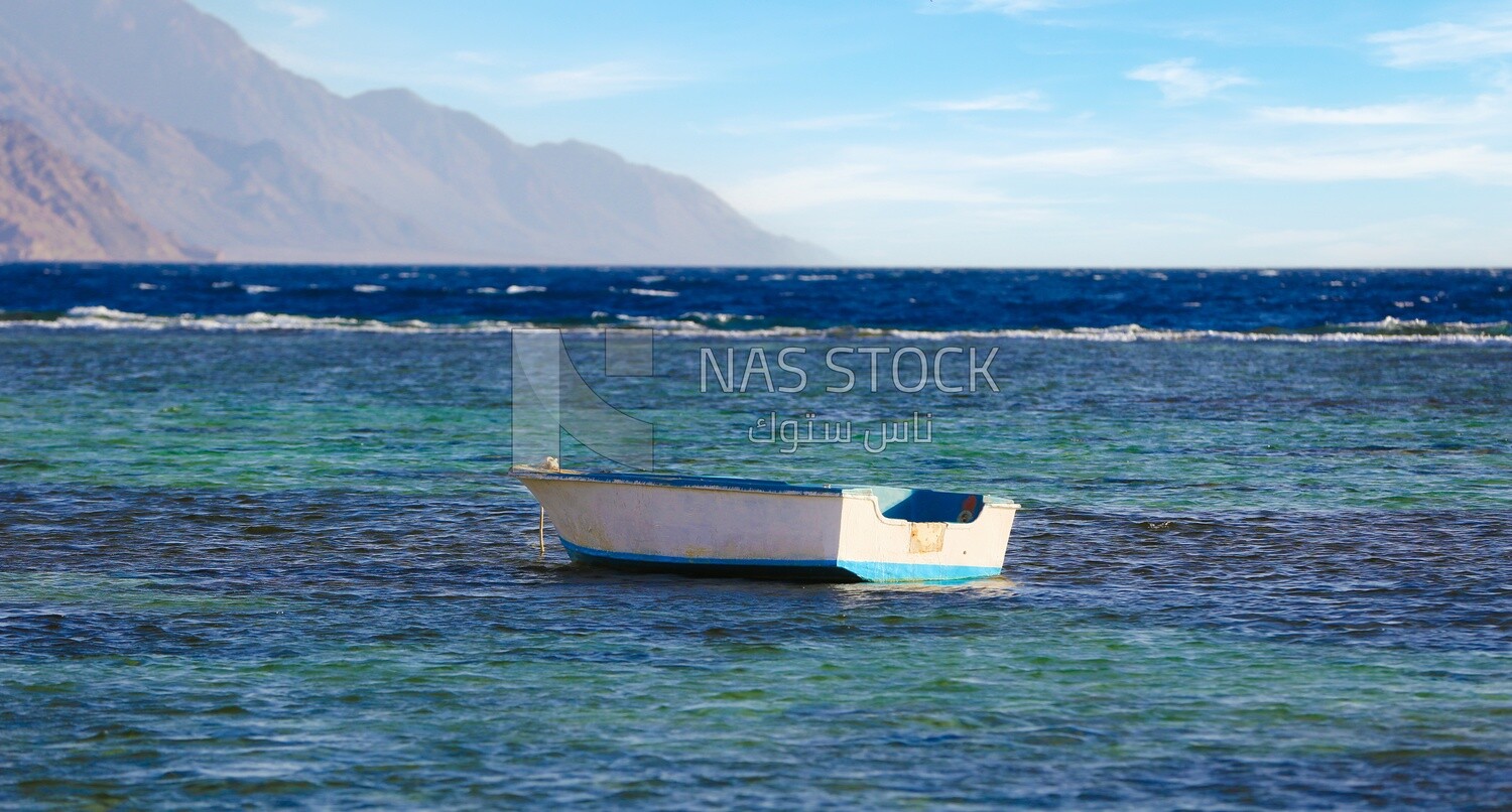 Wooden boat anchored in the waters of the Red Sea