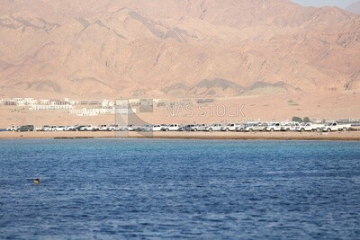 Beautiful sandy beach against the mountains.