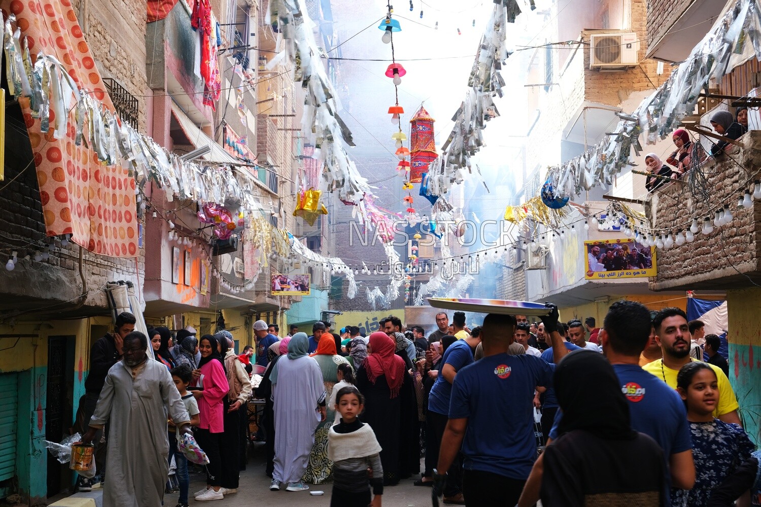 View of people in Matareya sharing their iftar together in the street, Ramadan Kareem, preparing their iftar