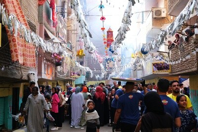 View of people in Matareya sharing their iftar together in the street, Ramadan Kareem, preparing their iftar