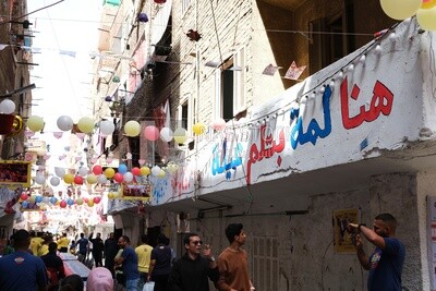 View of people in Matareya sharing their iftar together in the street, Ramadan Kareem, preparing their iftar