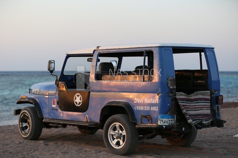 Safari car parked on the beach